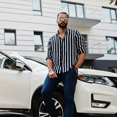 Spring-Auto_Insurance man with white car<br />